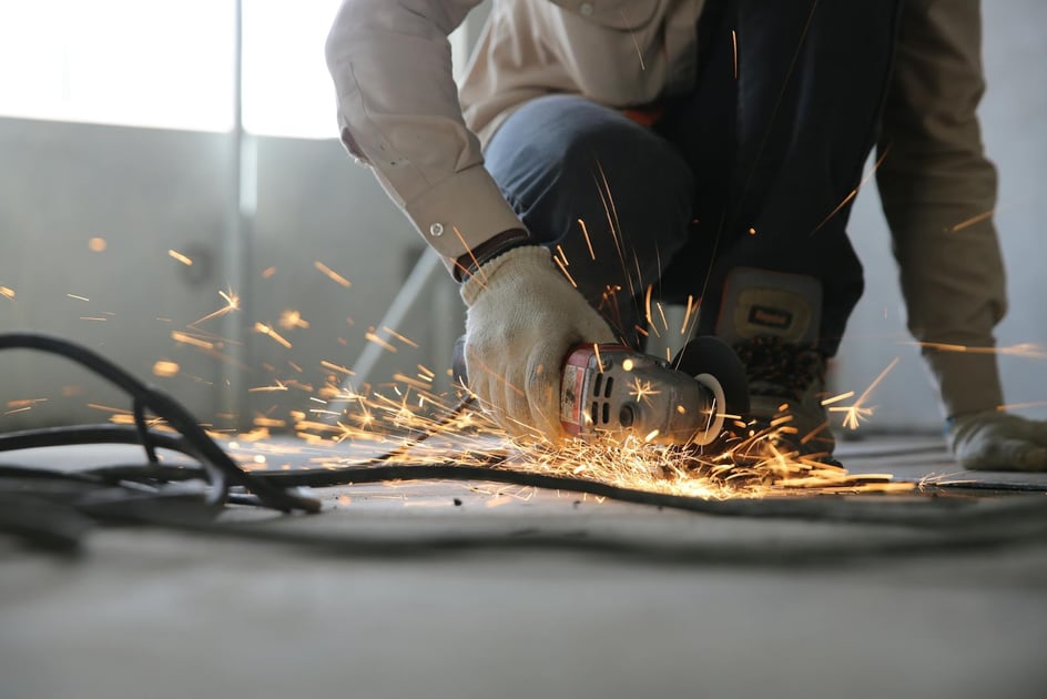 man using circular cutting tool